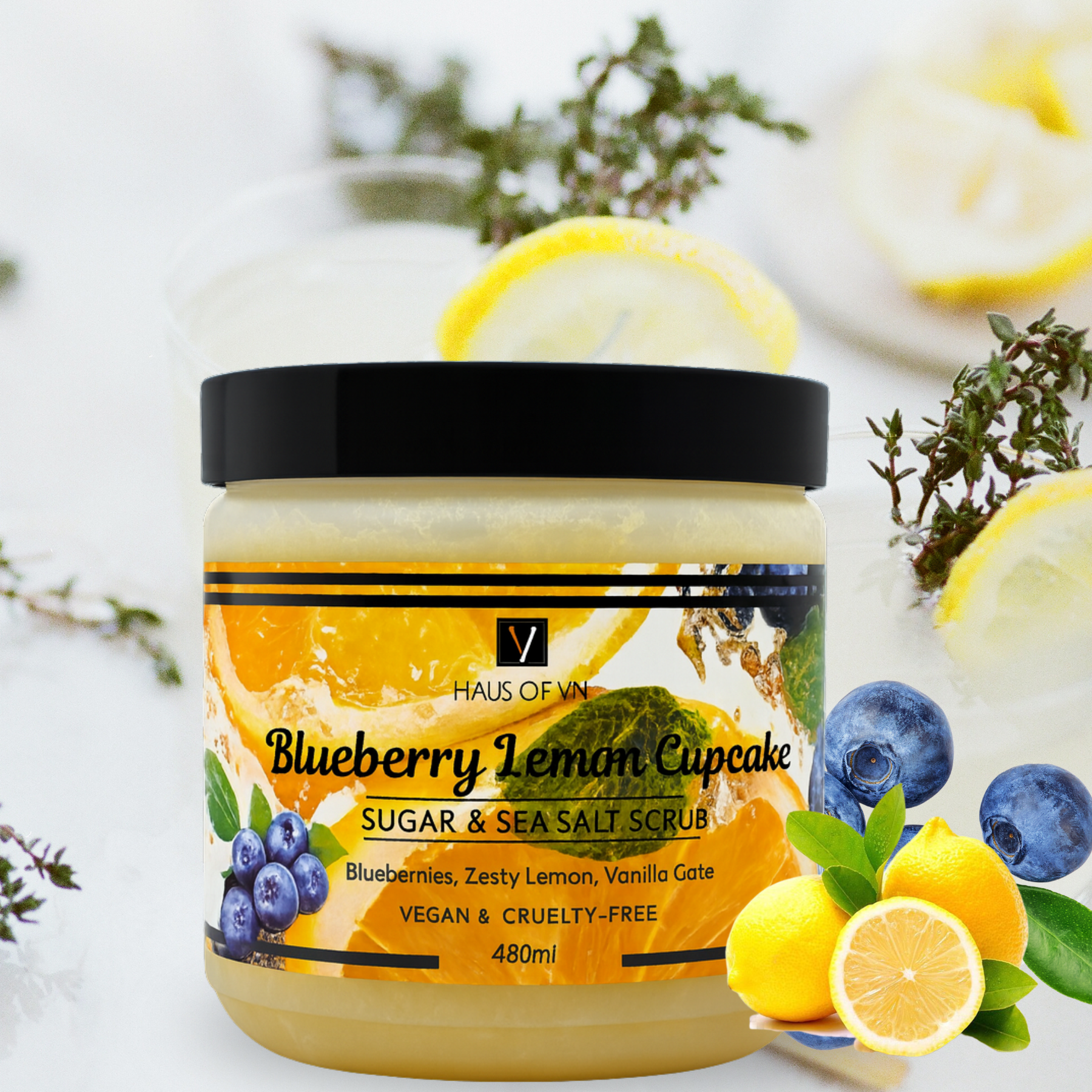 Jar of Blueberry Lemon Cupcake sugar and sea salt scrub with lemons and blueberries on a white background